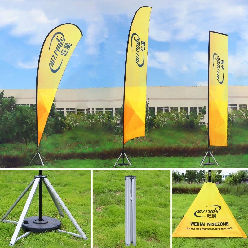 giant feather flags with gradient designs on grassy terrain