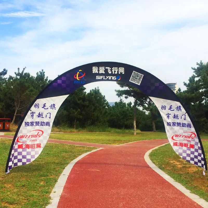 Outdoor racing arch gate setup on a red track, , set against grassy terrain for immersive drone racing applications.