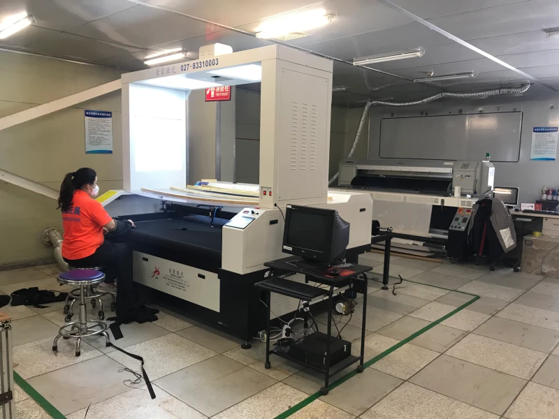 Professional printing equipment producing high-quality custom drop flags with vibrant colors and crisp details.