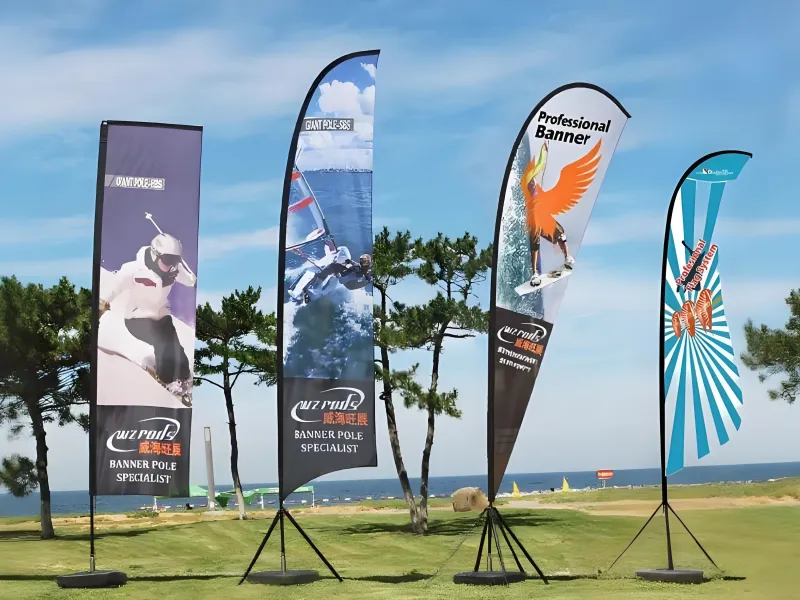 Four main types of flying banners: rectangle, feather, teardrop, and shark fin flags displayed outdoors.