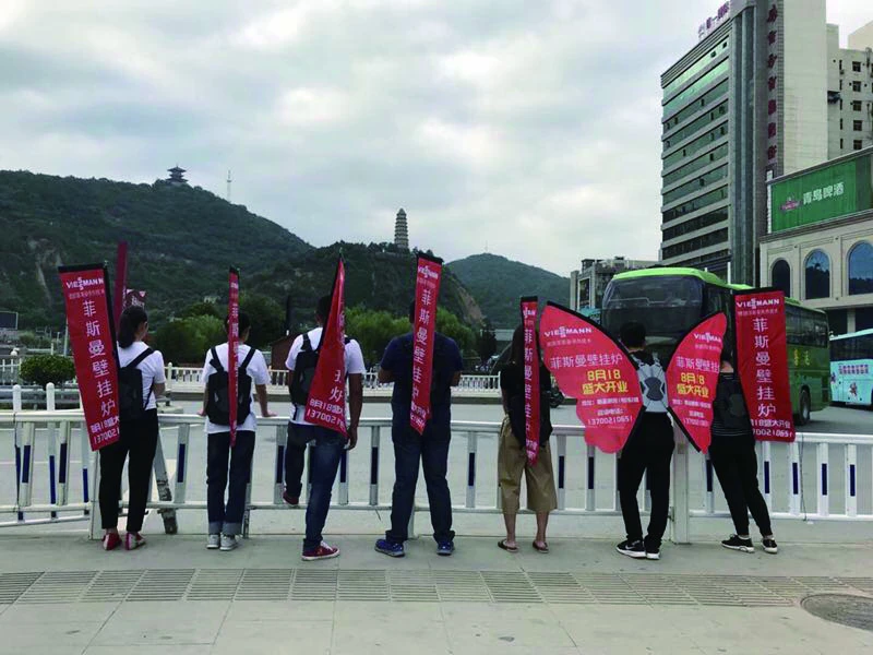 WZRODS red flags deployed for store launch events, compatible with mountain terrain and transportation hub marketing