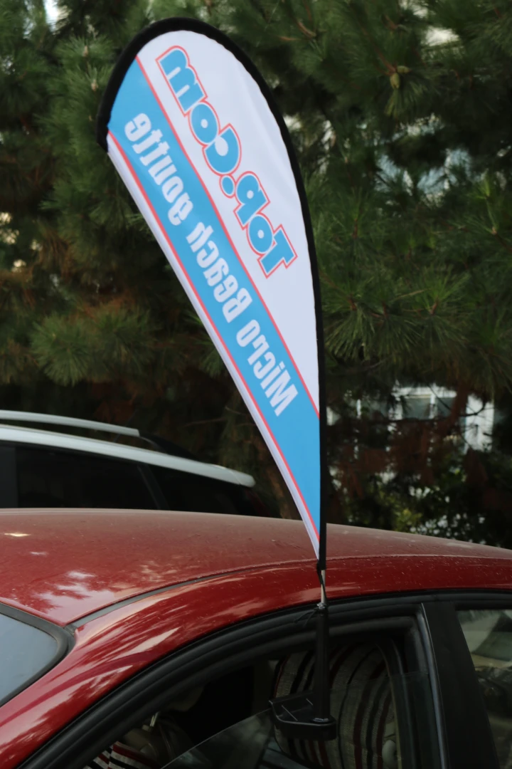 Car window flag with carbon fiber flagpole gallery 12 Blue/white teardrop car flag mounted on a red car