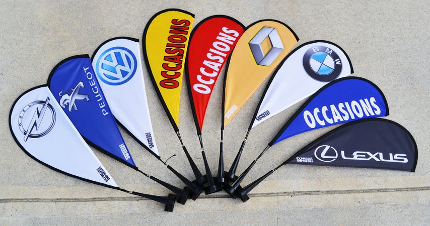 Car window flag with carbon fiber flagpole gallery 18 Diverse car window flags in multiple colors, fanned out for display.
