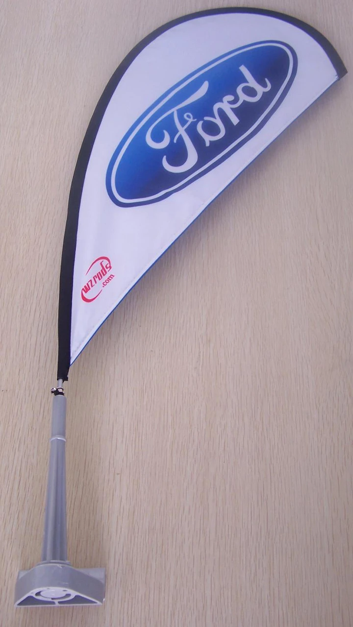 Car window flag with carbon fiber flagpole gallery 20 White teardrop car flag featuring a blue emblem, mounted on a pole.