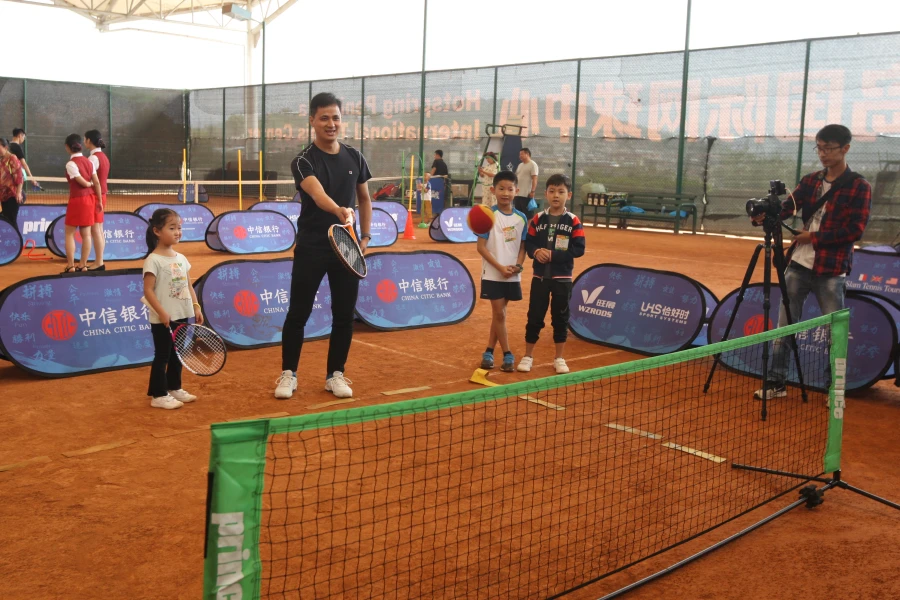 Youth tennis event using pop up banners for brand visibility