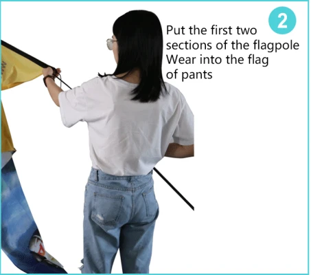 Inserting first two flagpole sections into flag pants sleeve